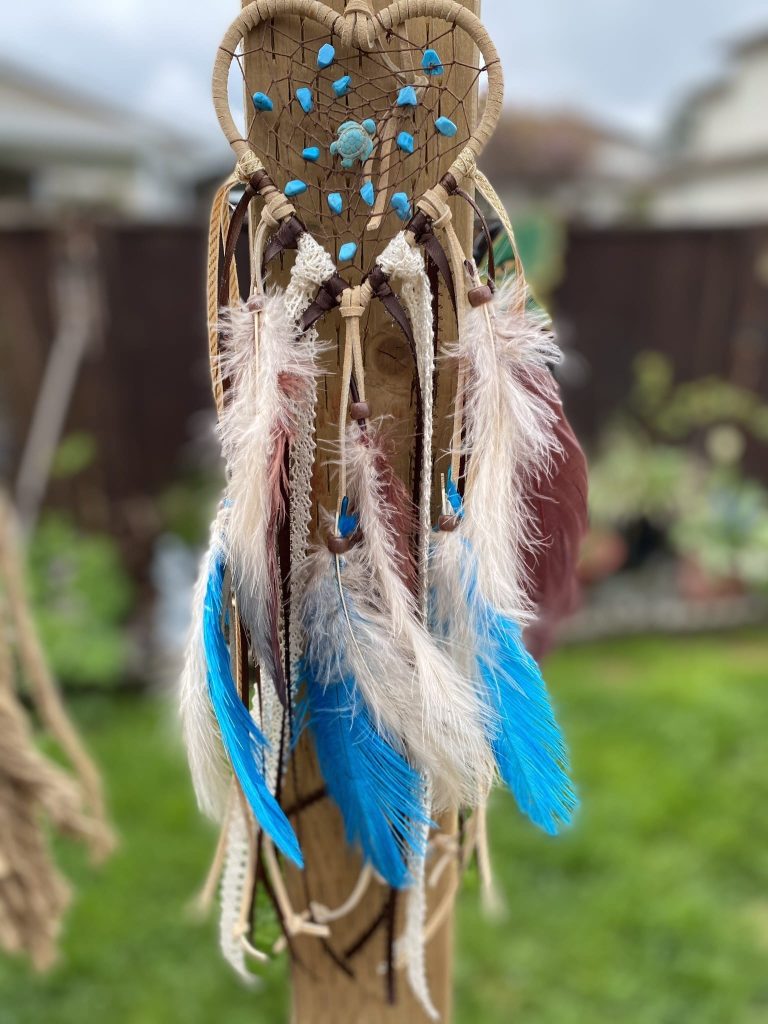 Dreamcatcher hanging in boho inspired bedroom